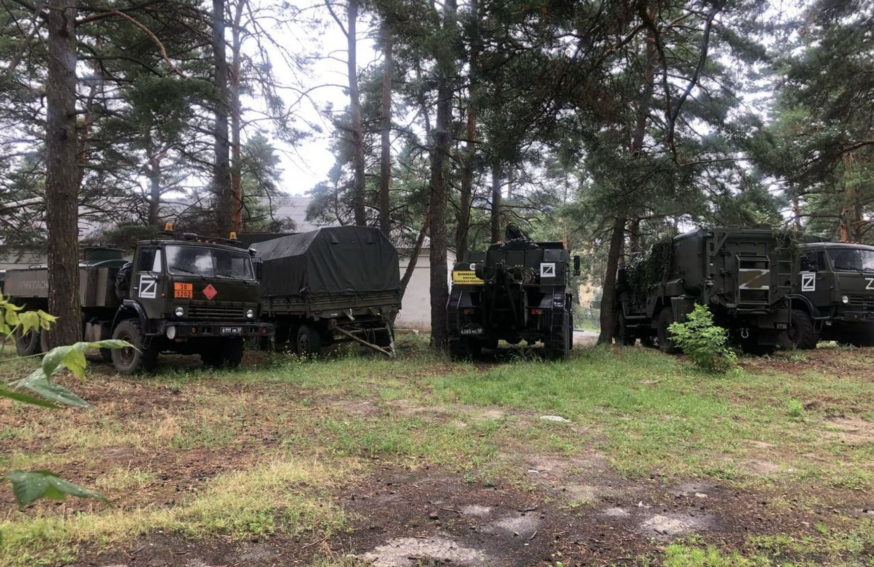 Military vehicles are parked in front of the Shebekino central district hospital