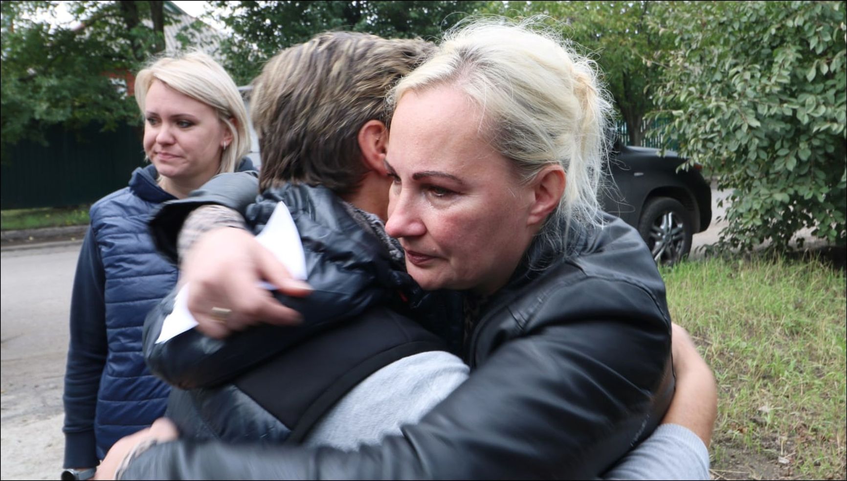 Kilintz and Kolbasnikova embrace, surrounded by ONF activists