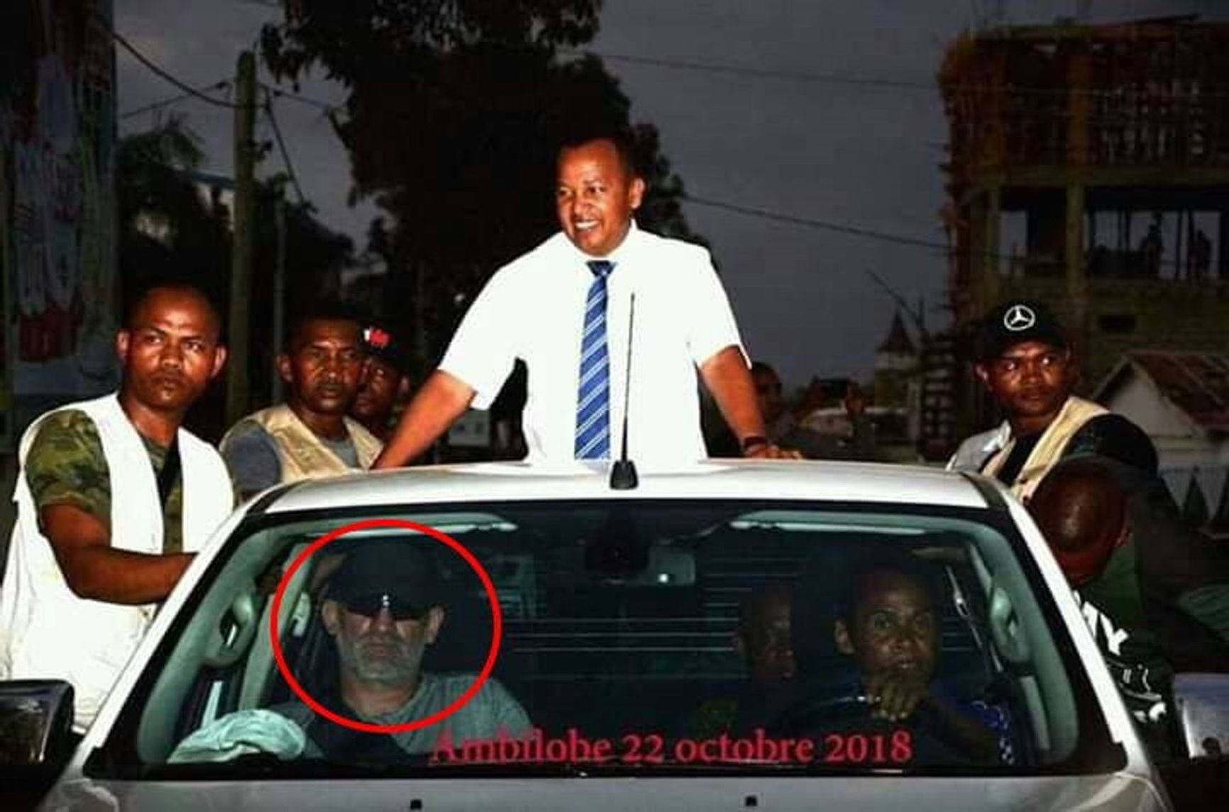 “Mazai” (in the car on the left) during the pastor's campaign
